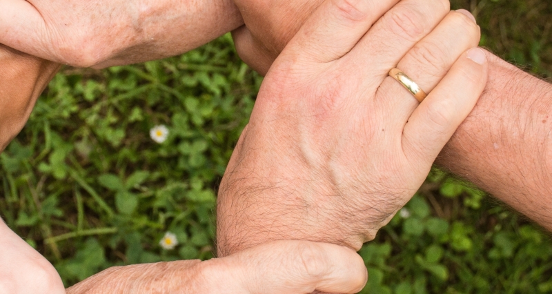 lawyers holding hands providing support